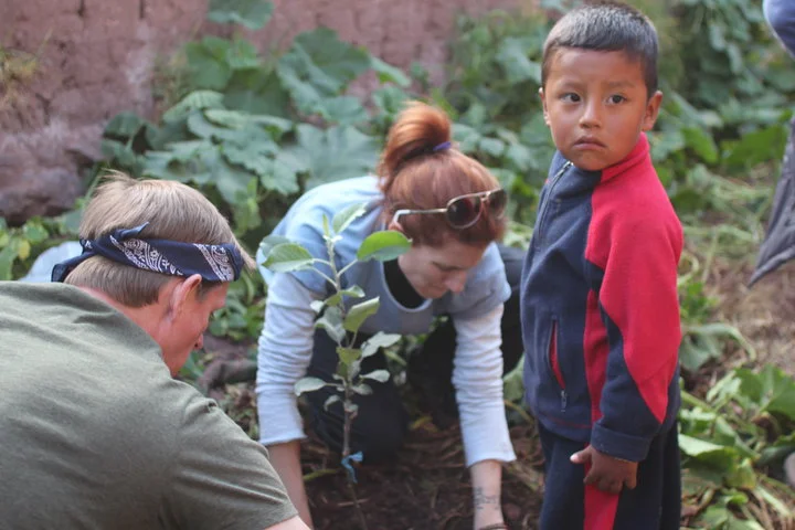 MP-John & Jessica planting with boy.jpg