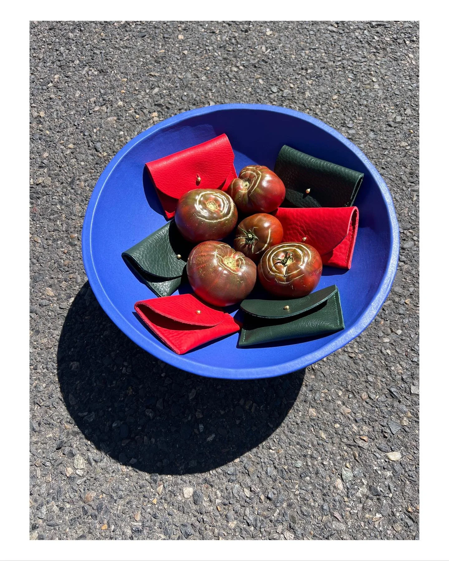 Heirloom tomatoes grown in our garden styled with the kelp and tomato cardholders in a gorgeous bowl  by @thegranite