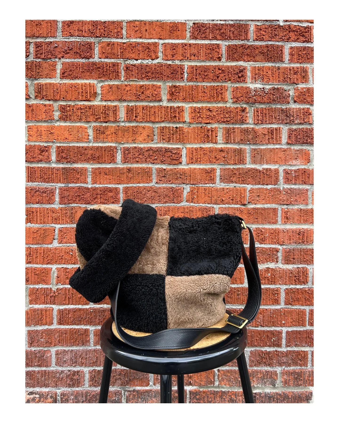 Our favorite color-way as of late ♡ 
Black and cocoa shearling! Pick it up in our shearling patchwork bucket bag or in our soon to be announced next shearling hat drop 🤎🖤🤎🖤