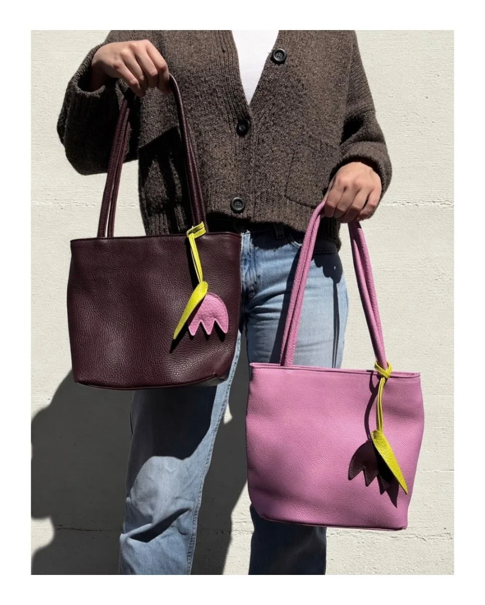 BAG CHARMS AND TASSELS TOMORROW AT 8am PCT 📣 📣 📣! Say hello to our Plum and Sorbet Tulip bag charms 🌷

All charms and keychains will be available online, in store and available for wholesale at your own shop!

For first dibs, come into our shop a