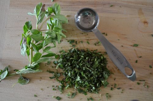  Finely chop some oregano; this is what fresh oregano looks like.  Pound these herbs together with a mortar and pestle if ya got one. 