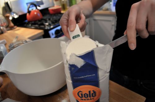 Meanwhile, in a bowl, we stirred two cups of all-purpose flour, 2 1/4 tsp yeast, 2 tbsp sugar, 1 tbsp salt. 