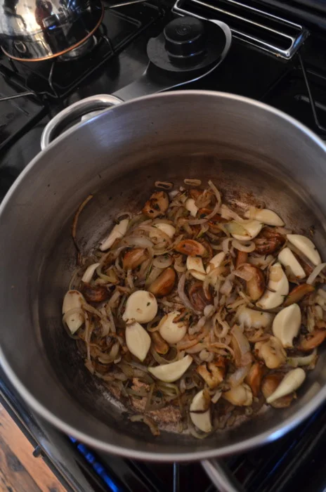Over medium-high heat, add a little olive o, the sliced onion, shallots, peeled garlic, roasted garlic…