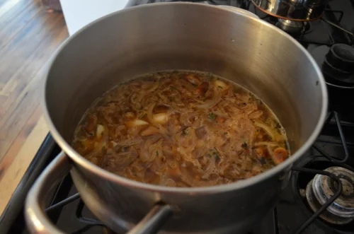 After 6 or so minutes, pour in 3 1/2 cups of chicken stock and then let it simmer for about 20 minutes.