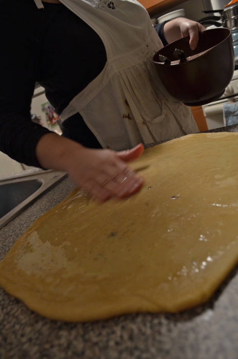  Here she is glazing the dough with her fingers.&nbsp; 