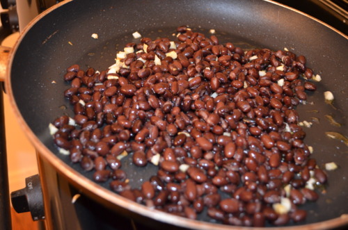  Little splash in the pan to get beans n&rsquo; garlic excited. 