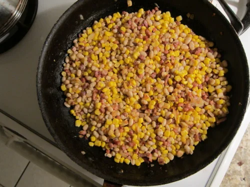 NOT TO SPOIL THE PARTY, BUT HERE COME WHITE BEANS AND CORN.