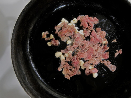 Prosciutto, chopped, follows. Let it brown…