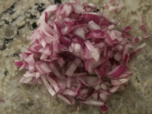  Now, on to the broth. Chop up half a red onion. 