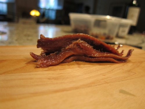 But it’s just for that salty flavor. Chop it up real small. It’s just gonna melt in the pan when you throw it in. Melt away gross, little anchovies.