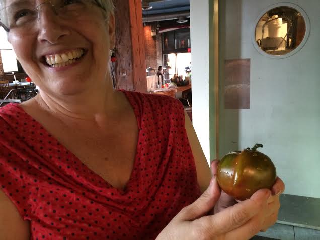 We laugh at the slightly misshapen Brown tomatoes.