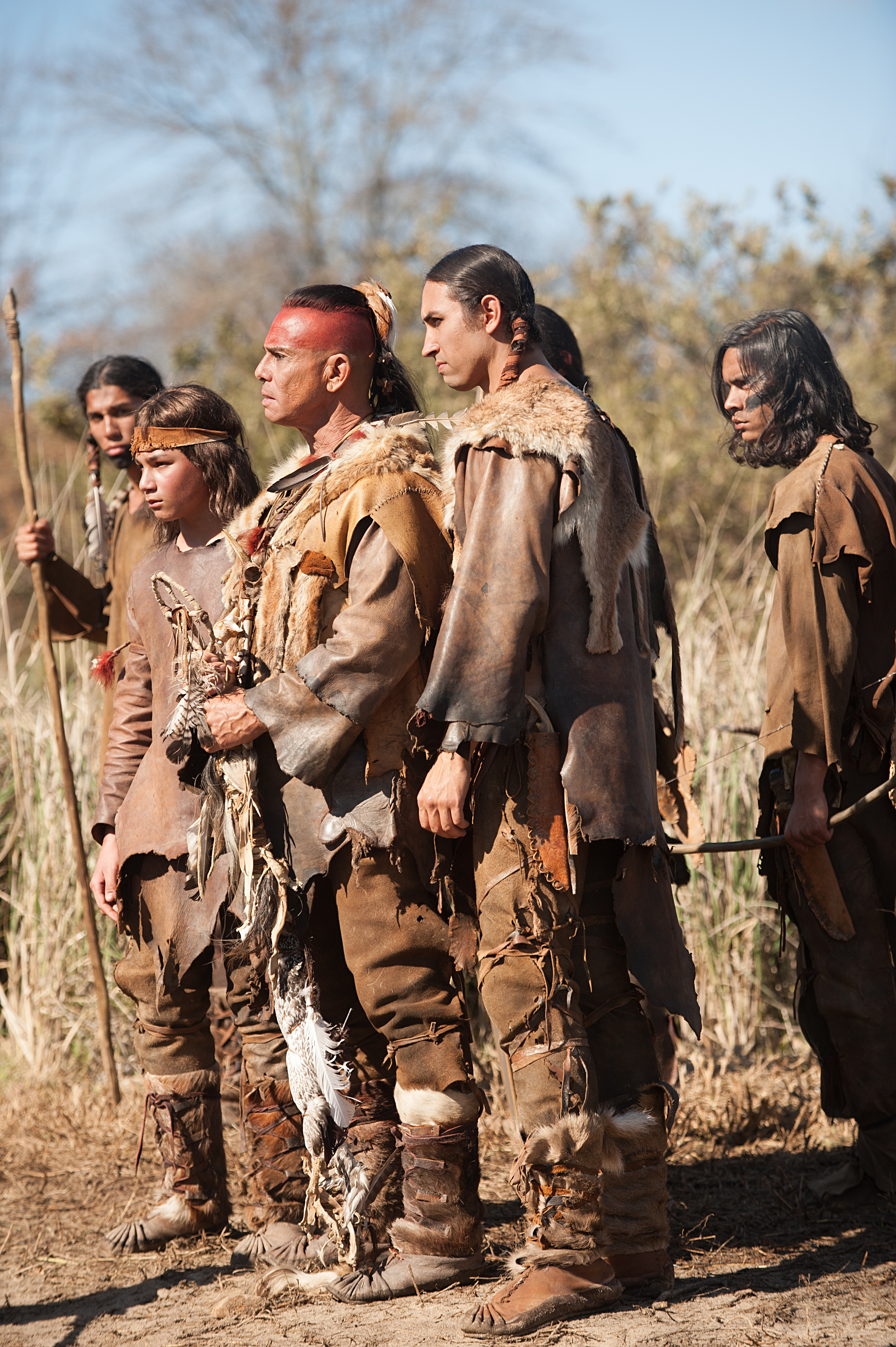 Raoul Trujillo as Massasoit, front center, in National Geographic Channel’s two-night movie event “Saints & Strangers,” premiering Nov. 22-23, 9/8c.
(photo credit: National Geographic Channels/David Bloomer)