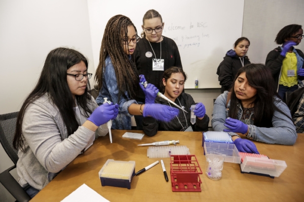Students from Orthopaedic Hospital Medical Magnet High School practice using pipettes to handle small amounts of liquid at the Stem Cell Day of Discovery event held at the USC Health Sciences Campus in Los Angeles, CA. February 4th, 2017. The event encourages students to learn more about STEM opportunities, including stem cell study and biotech, and helps demystify the fields and encourage student engagement. Photo by David Sprague
