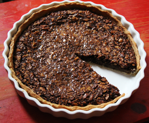 My Tennessee grandmother was famous for her delicious Southern pecan pie, and I've added chocolate and updated her recipe using less sugar. I also used walnuts, as pecans are difficult to find in Germany. However, both walnuts and pecans work well in this recipe and if you prefer a thicker filling, you can use a smaller pie pan too. Enjoy! 
