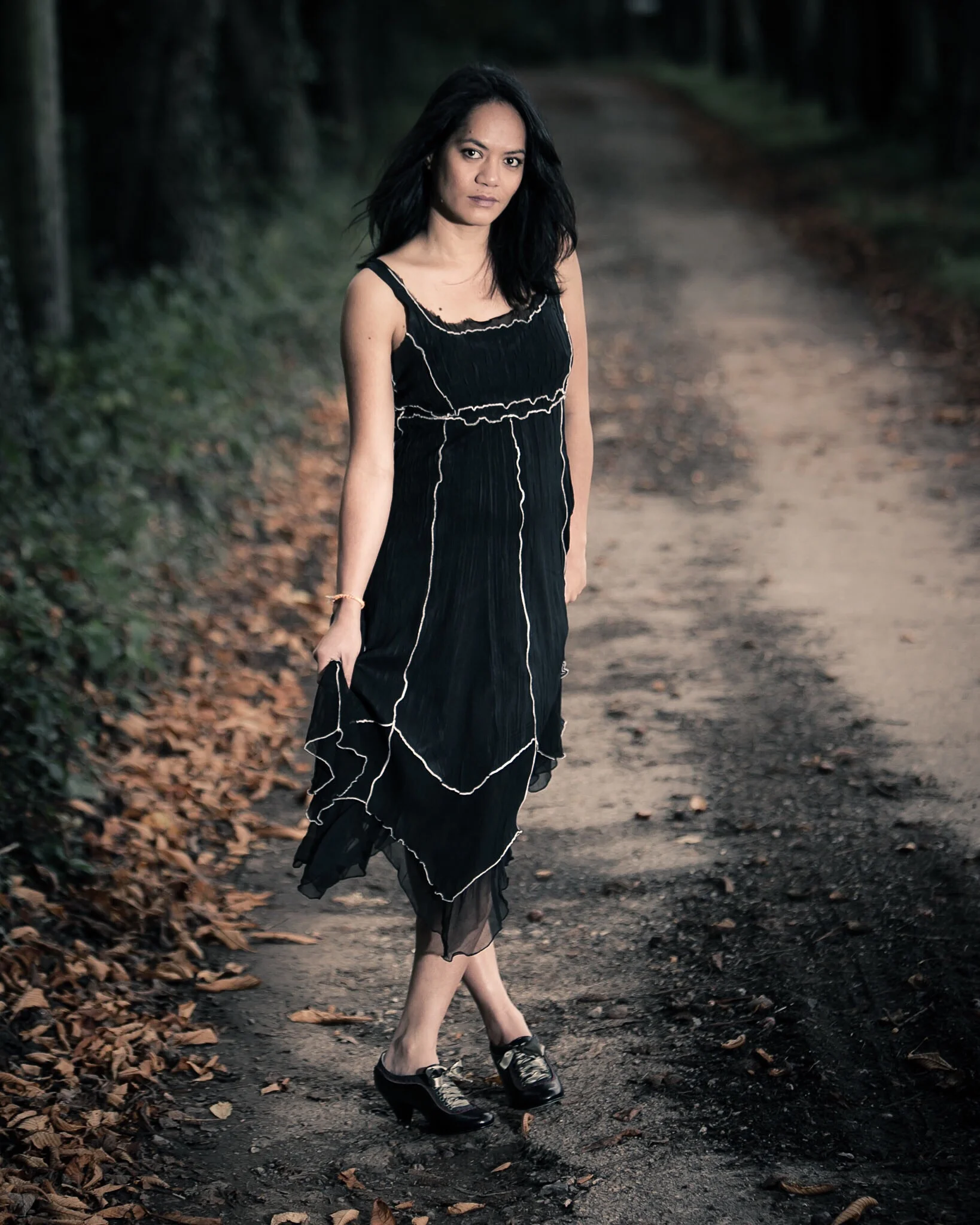 The use of dark colours with a large depth of field and off camera flash can create a different look
