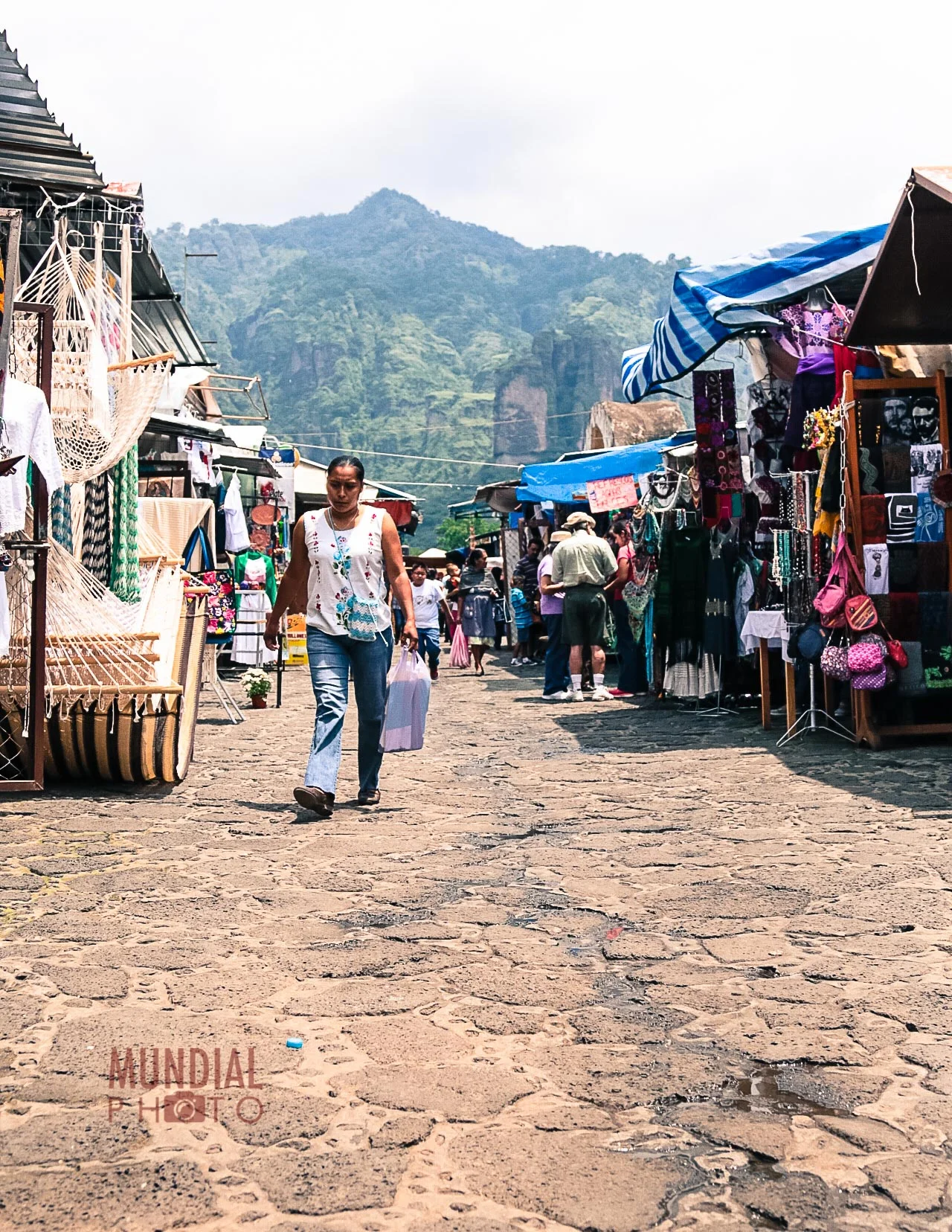 A more turistic market view in Tepotzlan. The hamacas, bags and locally made artefacts for tourists mix with everyday essentials. bartering is expected but with respect. I once remember making a bargain with a vendor in Coyoacan, (a popular district in South easten Mexico City), for a hand woven tortilla blanket, only for an unseen voice to bellow to the vendor that it was too cheap to seel at that price. The vendor's wife who was clearly in charge had been listening (unseen) and this was a signal that the price had been driven too low.