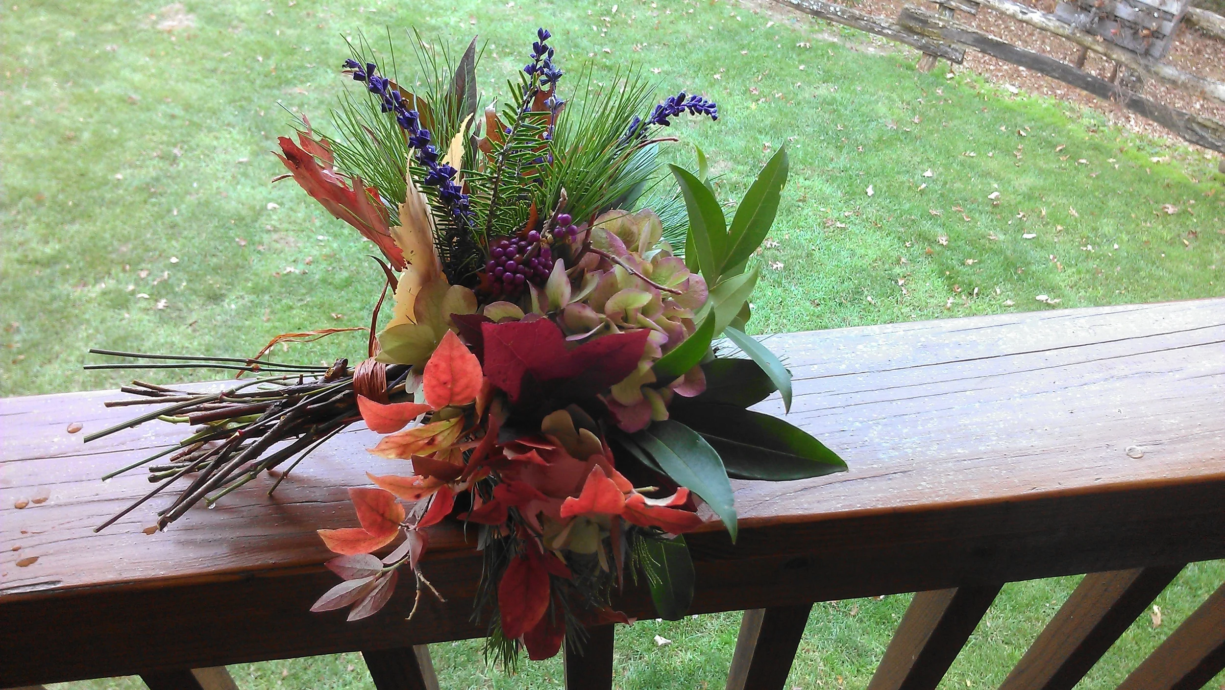 This last minute, all natural bouquet included an assortment of fall leaves, laurel leaves and pine, moss, pinecones, nandina berries, beauty berries, a single green hydrangea and a few sprigs of salvia.
