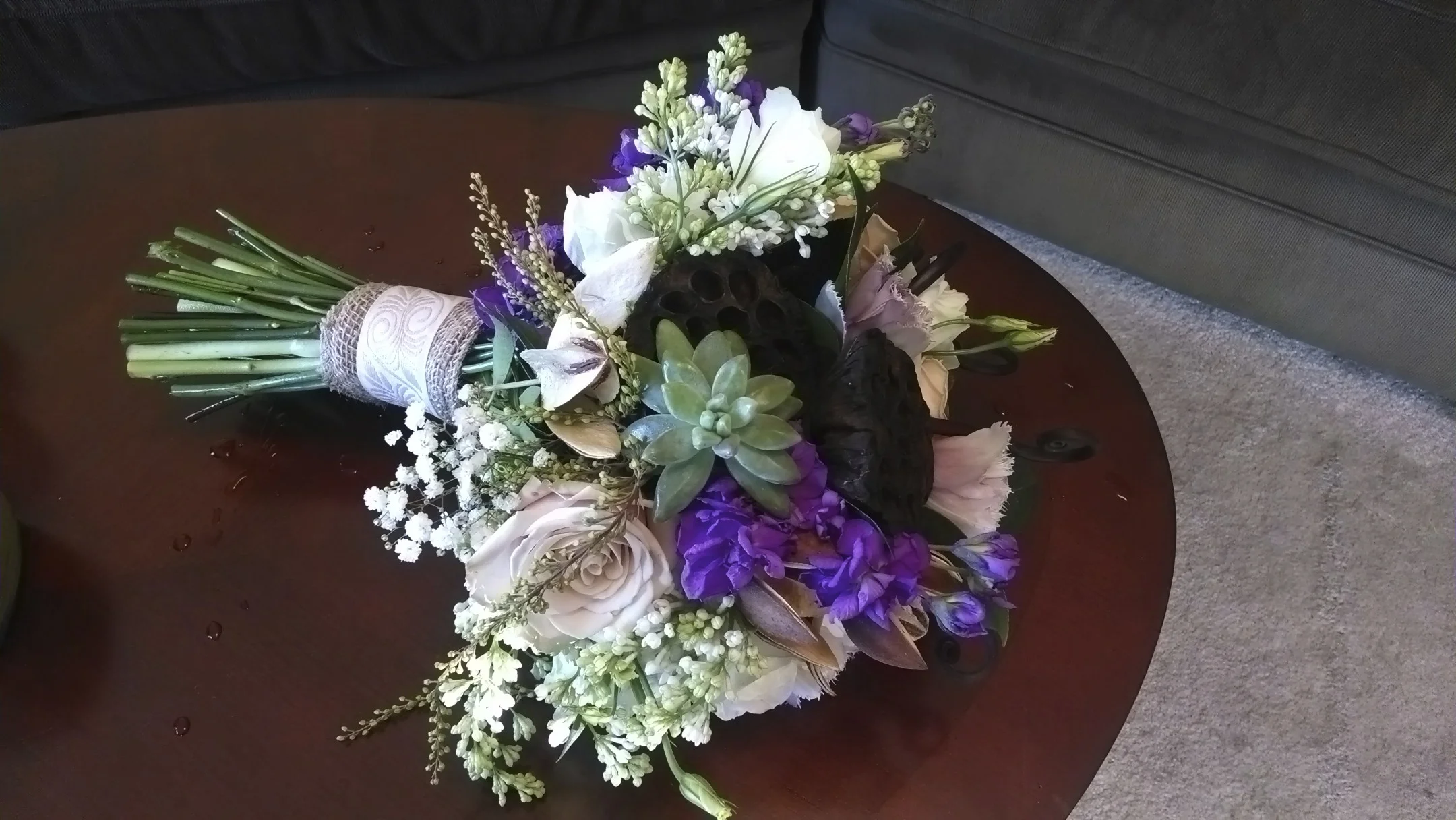 Succulents, Roses, Stock, Babies Breath, dried Lotus Pods.