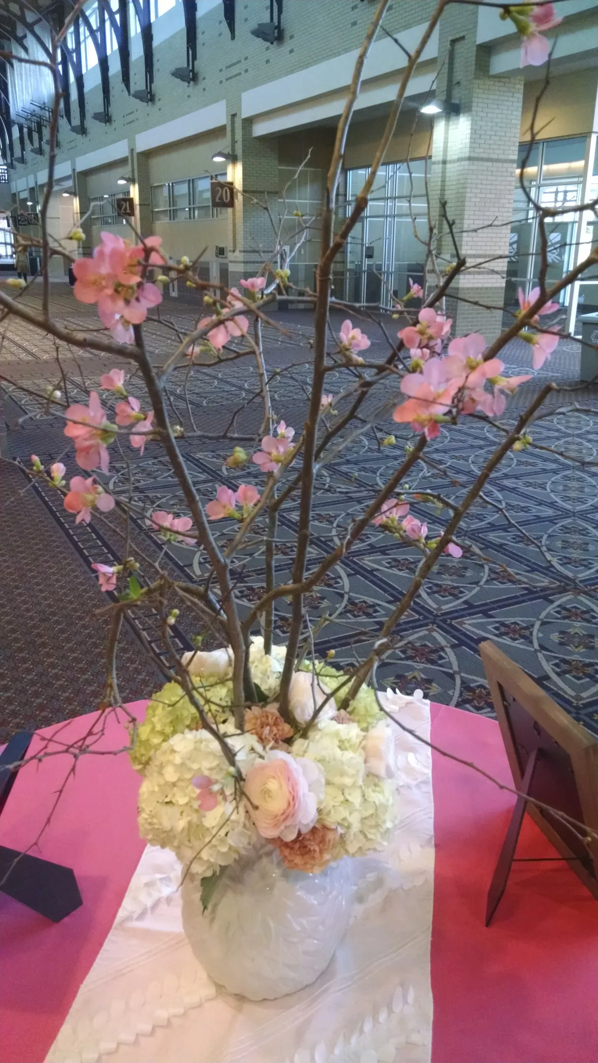 Flowering Quince branches with hydrangea, ranunculus and carnations.