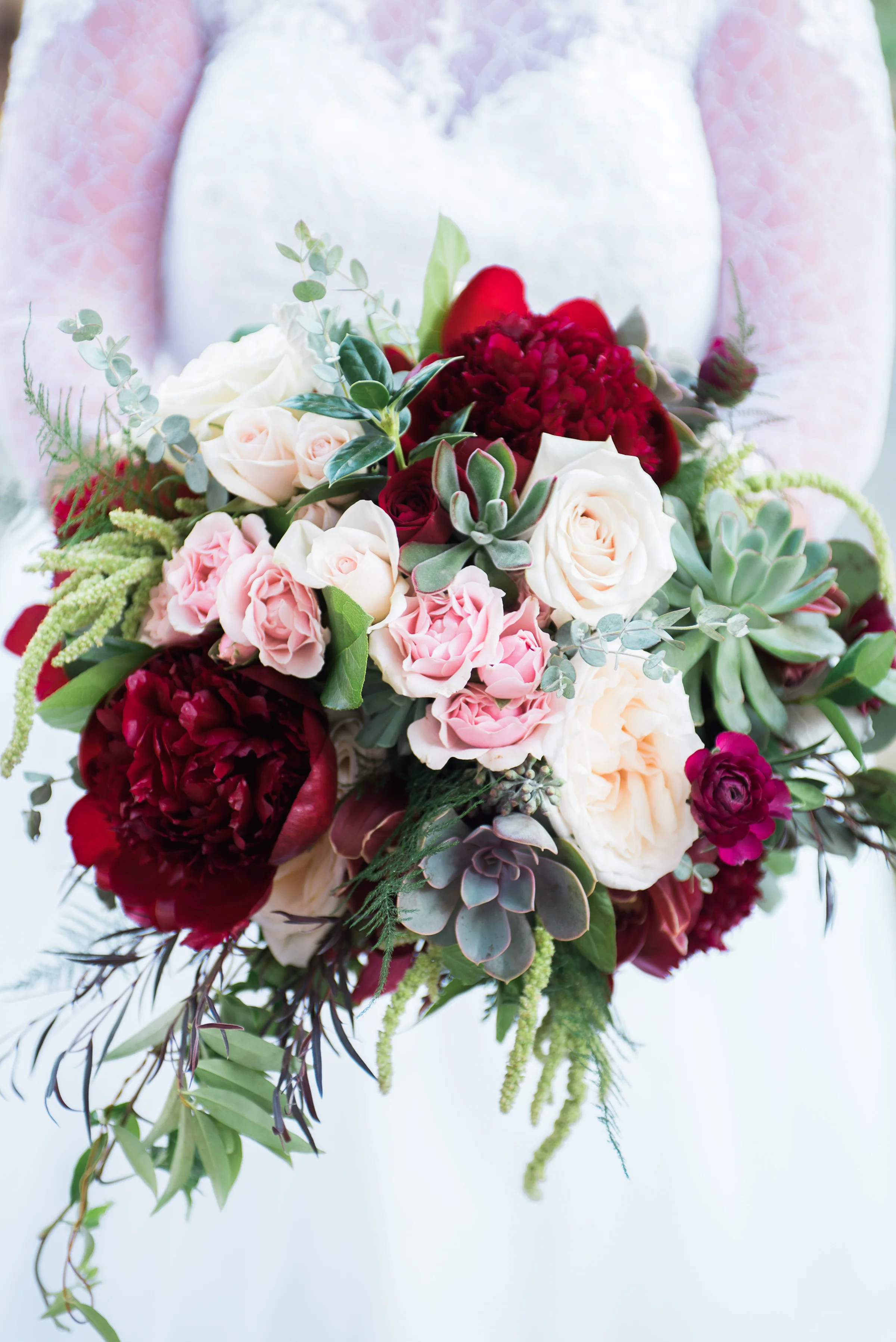 Red Charm Peonies, White Ohara Garden Roses, Majolica Spray Roses, Succulents and Amaranthus. Photo by Martha Howell Photography. Coffey Barn, Cleveland TN