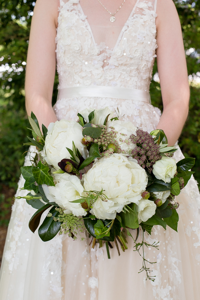 Peonies, Lisianthus, Burgundy Queen Anne's Lace and Magnolia Leaves. Photo by Kenney Photography. Waterhouse Pavilion, Chattanooga TN