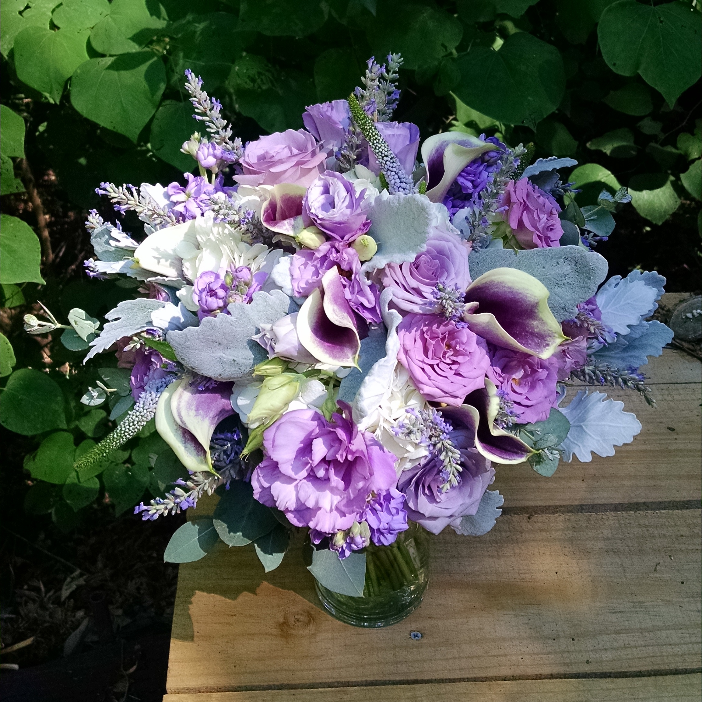 Picasso Calla Lilies, Lisianthus, Roses, Stock, Lavender, Veronica, Hydrangea, Dusty Miller. Photo by Tami McAllister