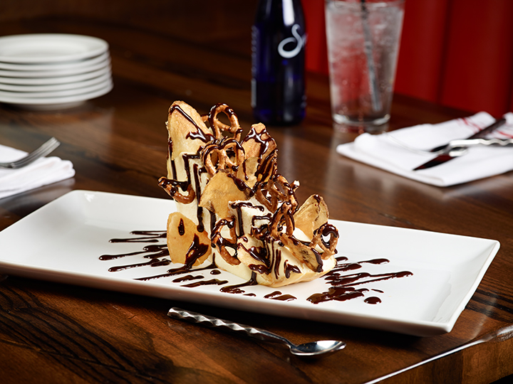 Dessert Option: Cheesecake rolled in potato chips and pretzels, drizzled with chocolate syrup