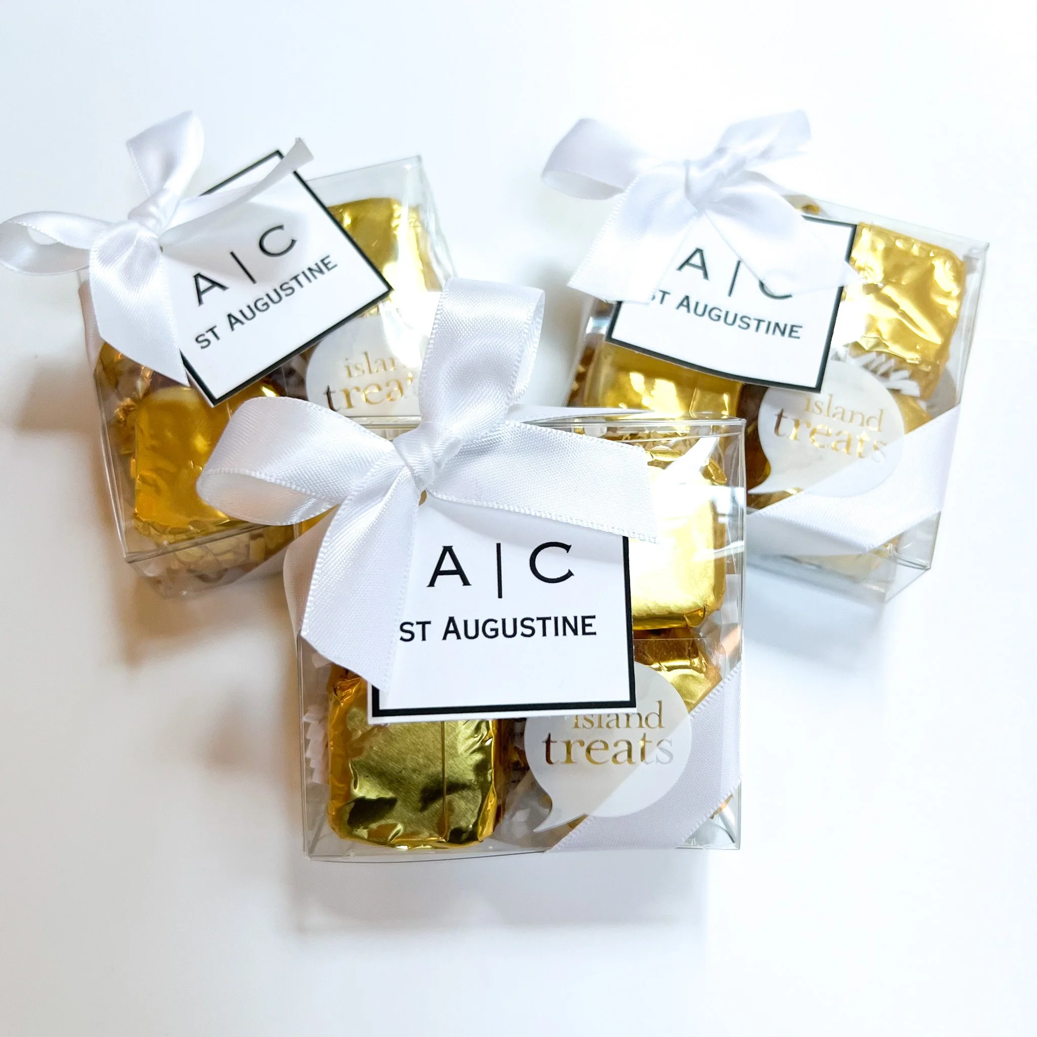 Handcrafted chocolate gift boxes from a Seattle chocolate maker, packaged for celebrations with custom tags and ribbon.