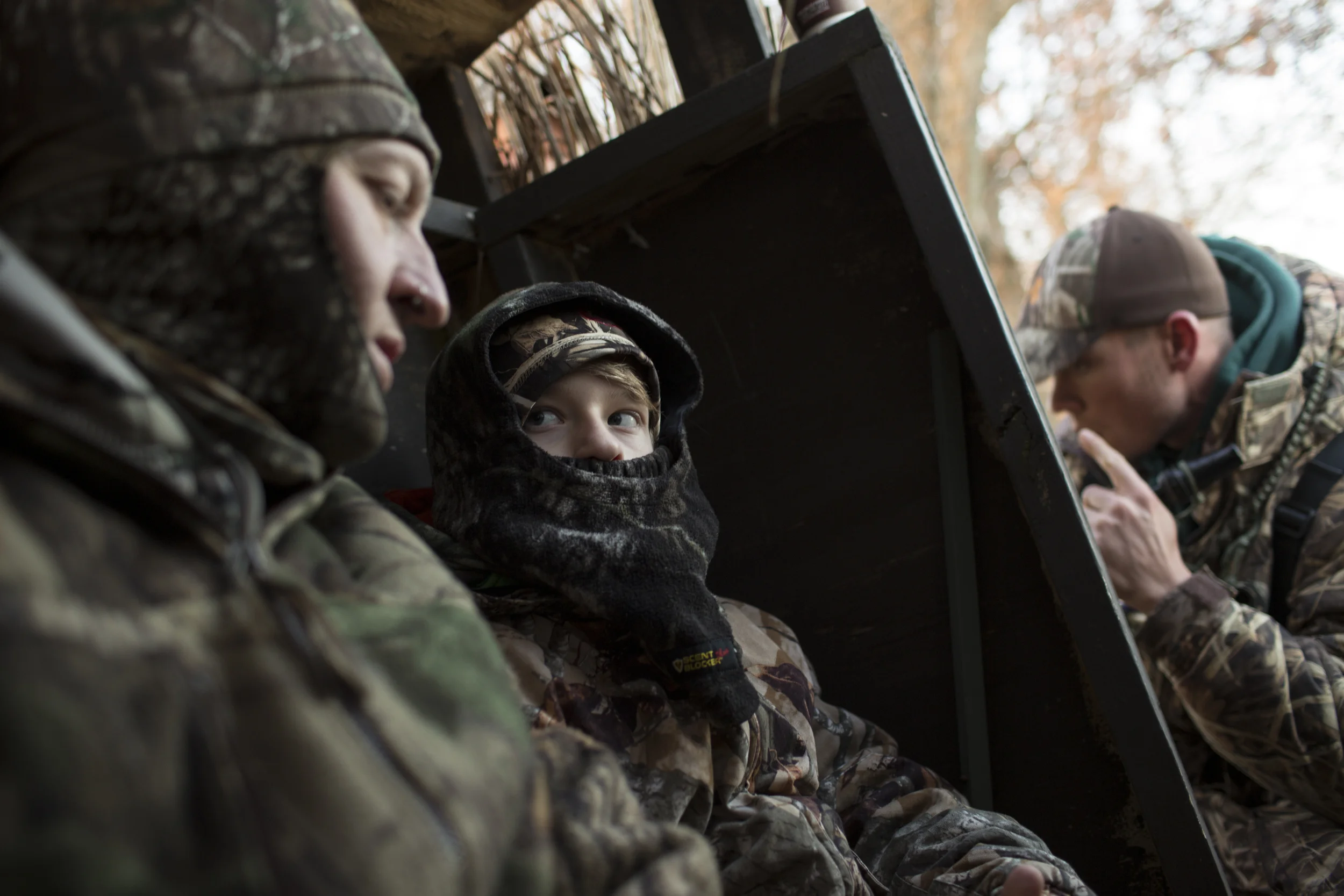 Cruz listens to a lesson from his father while sitting in a hunting blind during a goose hunt on the Eastern Shore of Maryland, near Easton.