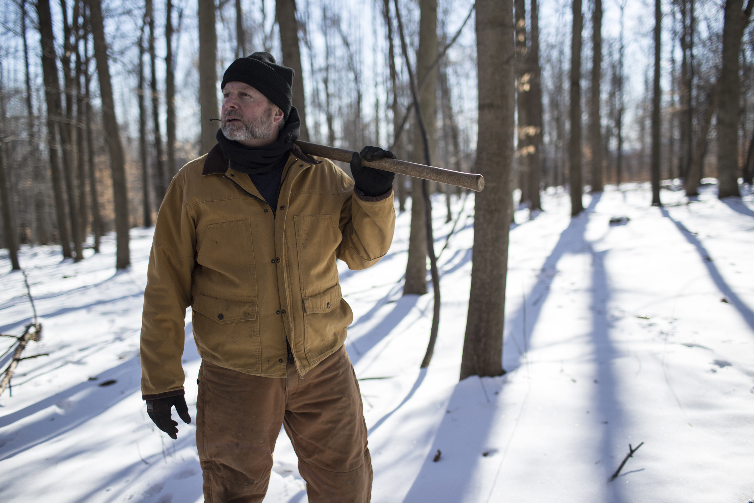 Barry Howe waits during a tree planting session to re-vitilize a hunting area, near Indian Springs, Maryland. 