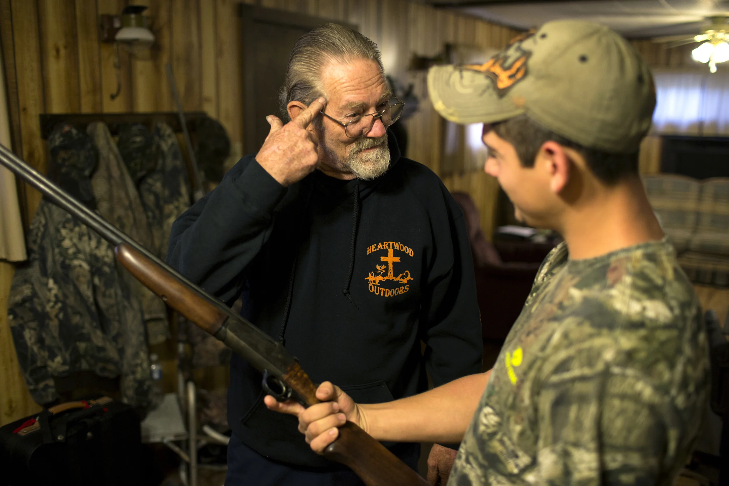 Doug explains to Dale the perks and efficiencies of hunting deer with a rifle rather than a bow at a hunting camp near Indian Springs, Maryland. 