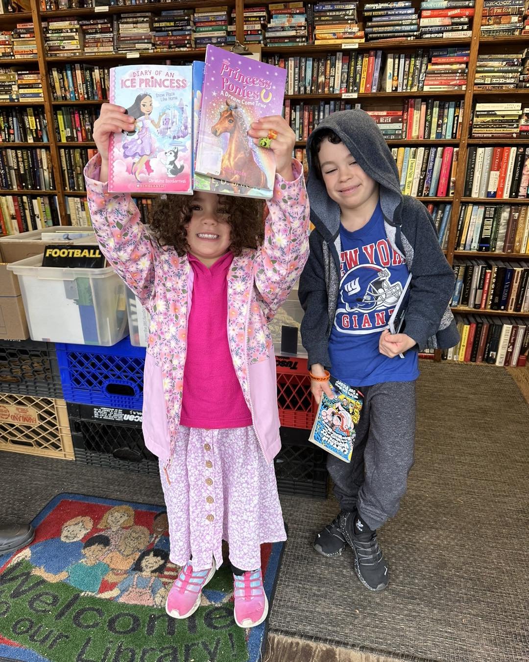 Hailey and Noah selecting some books.