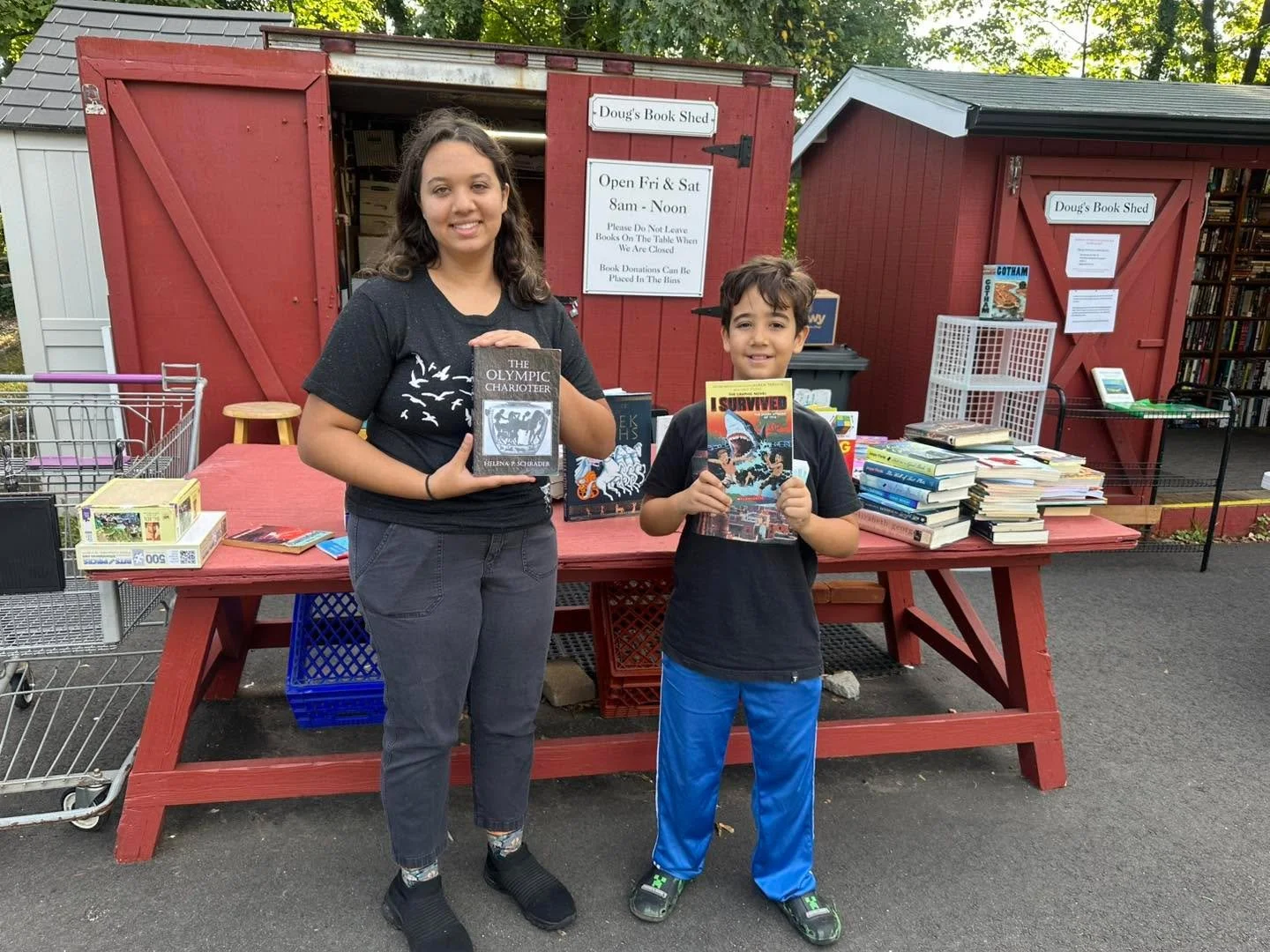 Aly and Khadija dropping off a treasure trove of books!