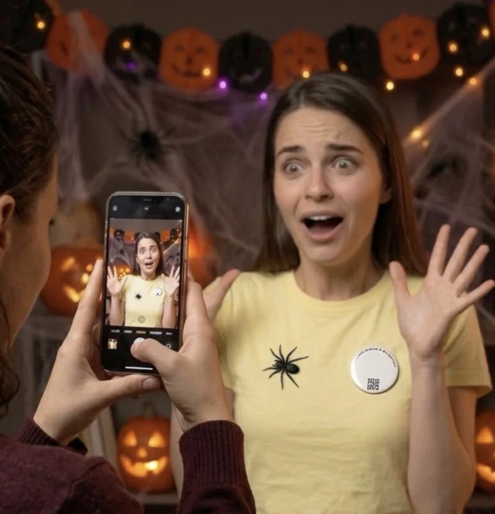 spider badge on T-shirt through Phone.jpg