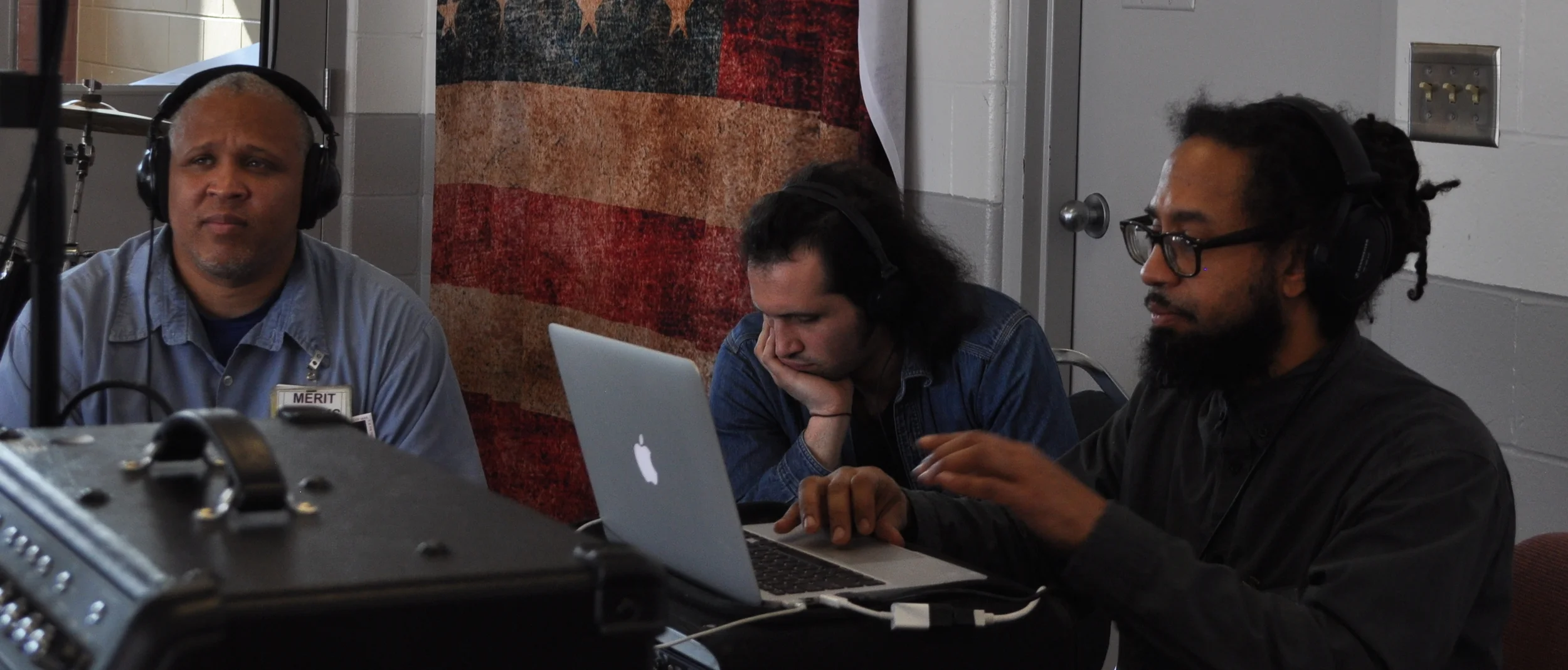 Mark Springer (collaborator), Fury Young (center) and Doc Israel (right) working with one of the prisoners