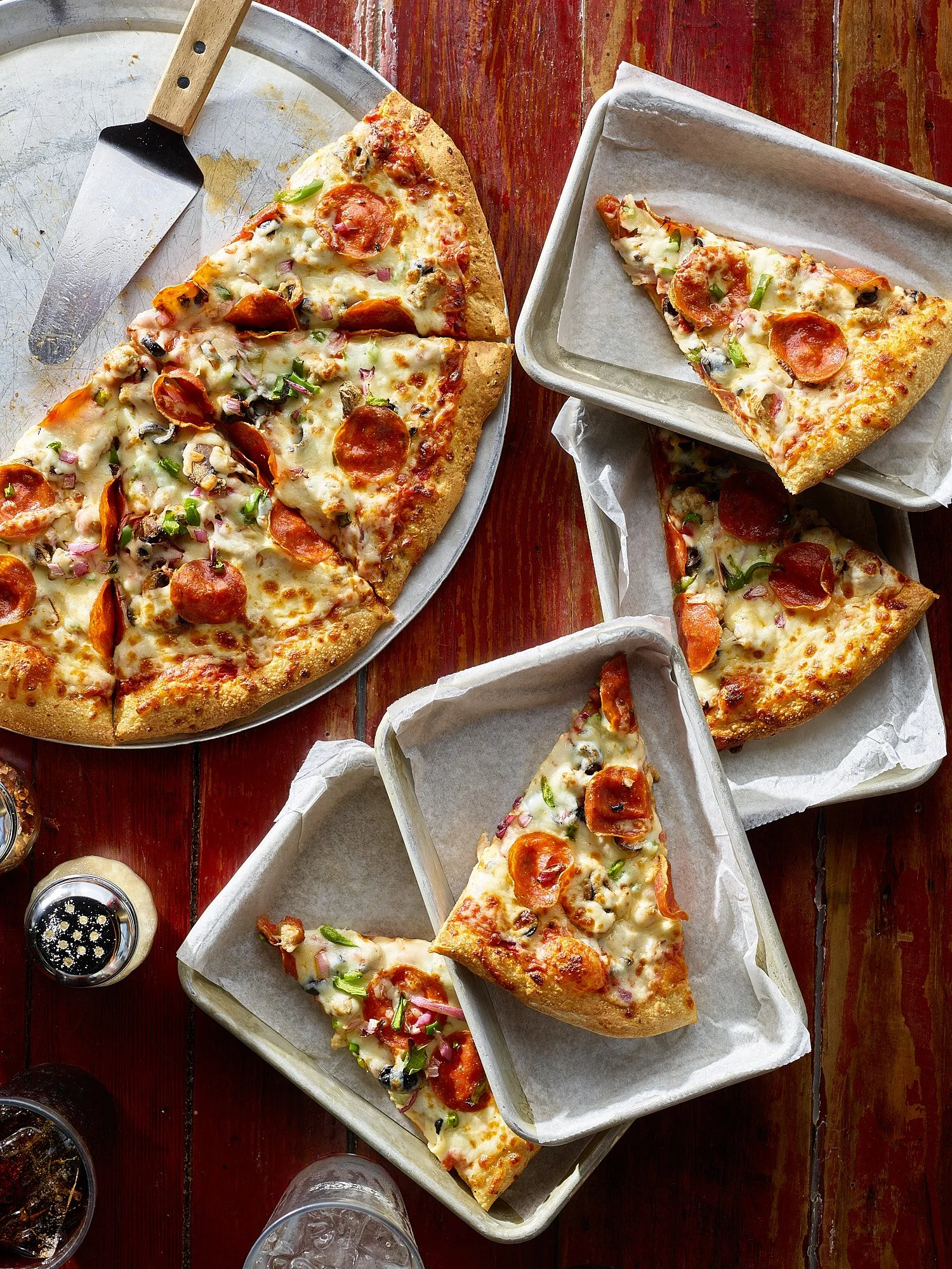 Food advertising photography by Dhanraj Emanuel — pepperoni and vegetable pizza on metal tray, shot for restaurant and CPG clients. Commercial food photographer based in Greensboro NC, available nationwide.