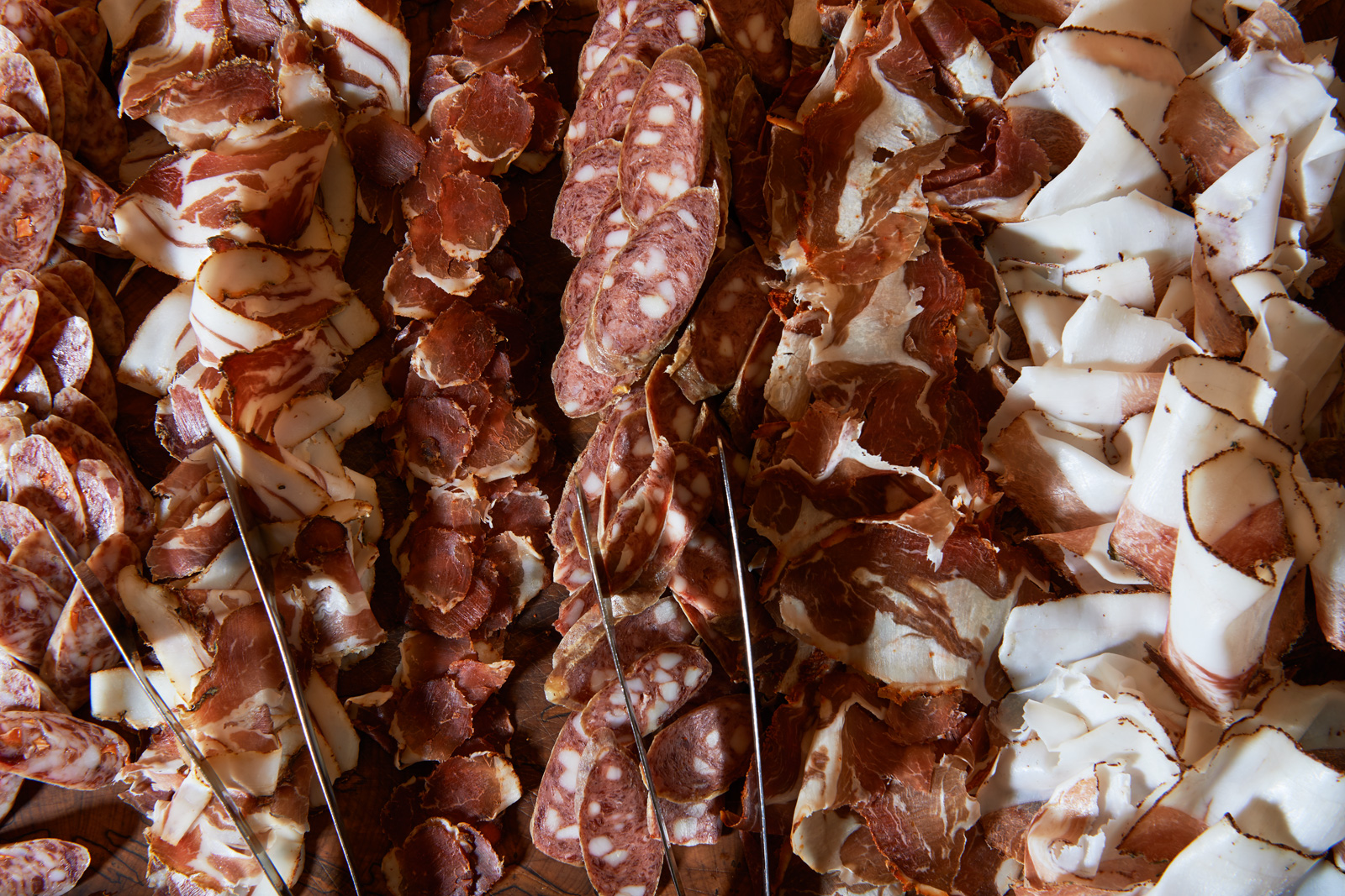 Charcuterie, L-R Fullsteam Carver & Friends Salami, Dusty Foothills Coppa, Peach and Corno Di Toro Lonzina, Old World Beef and Pork Salami, Carolina Hot Lamb Ham, Blueberry and Appalachian Wild Ginger Short Loin, Mole & Pumpkin Seed Salami