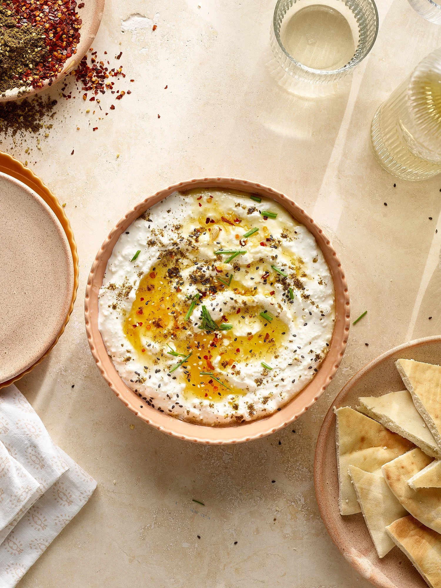 Commercial food photography by Dhanraj Emanuel — creamy yogurt dip with soft-boiled eggs, red pepper flakes, and chives, shot for The Fresh Market. Food advertising photographer working nationally for CPG and grocery brands.