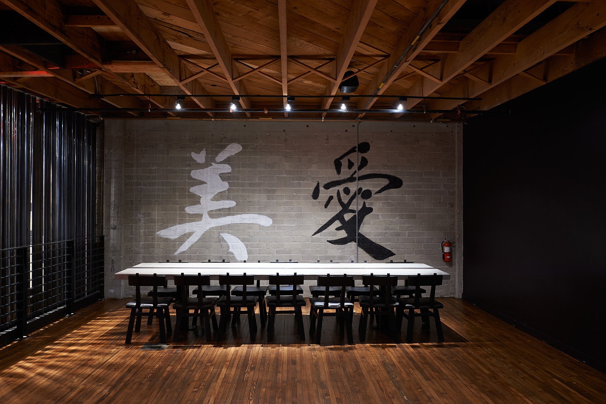 RestauranRestaurant interior dark wood Chinese calligraphy San Diego hospitality photography by Dhanraj Emanuel, restaurant photographer national