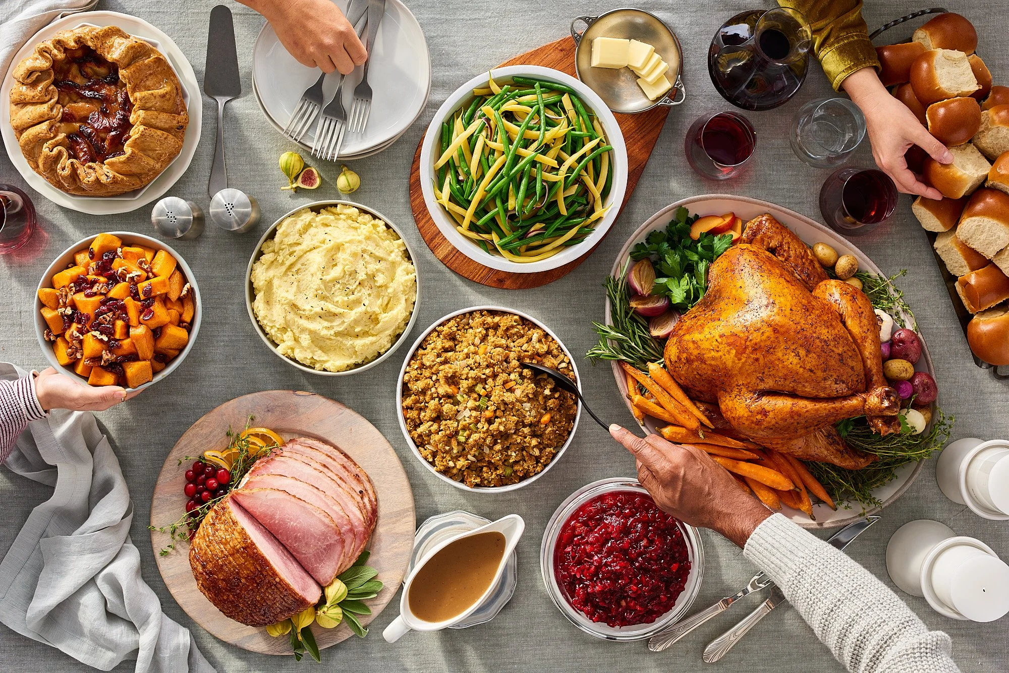 Holiday turkey feast overhead hands food advertising photography for The Fresh Market by Dhanraj Emanuel, CPG food photographer Greensboro NC