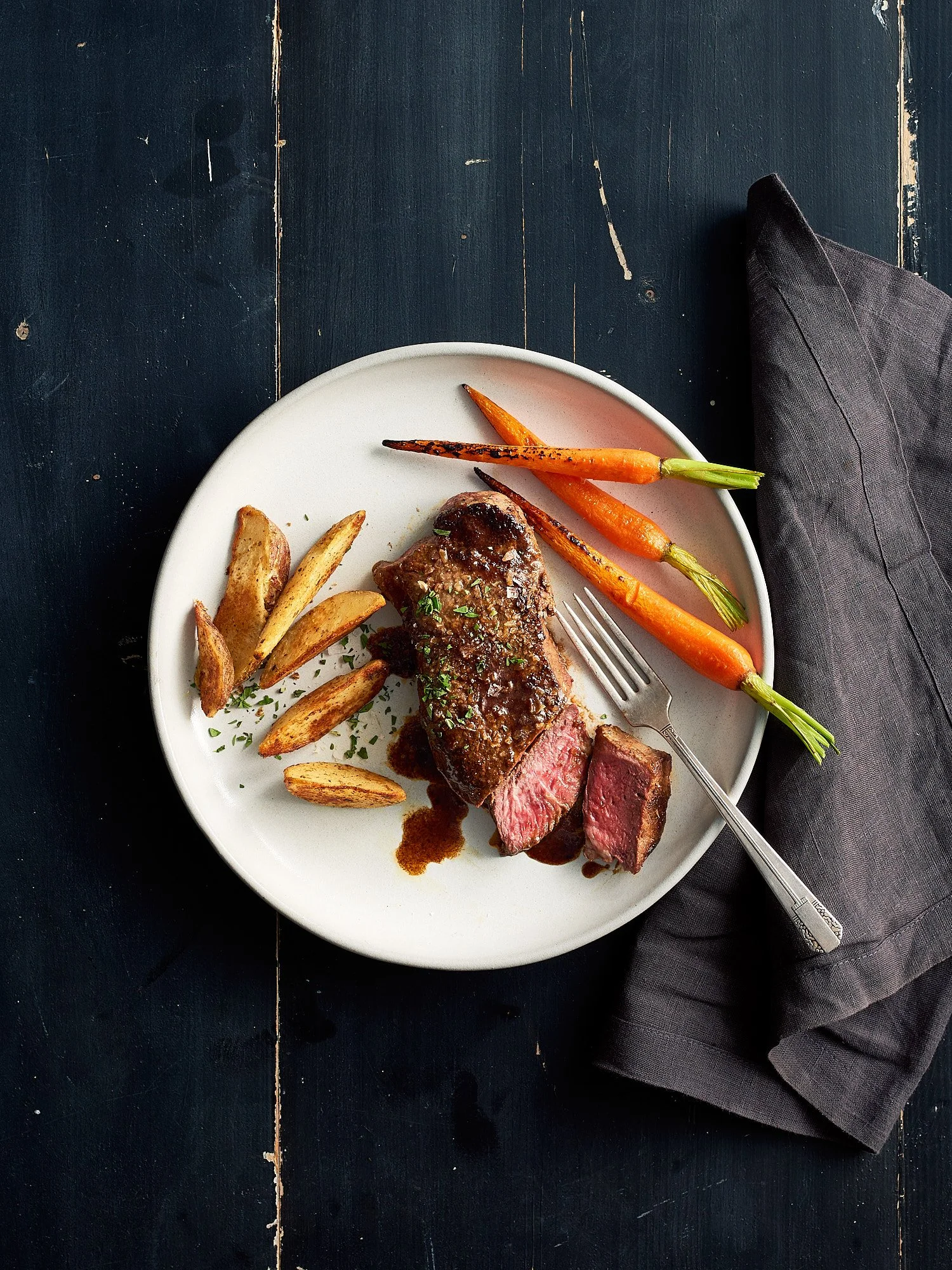 New York strip steak dark navy The Fresh Market food advertising photography by Dhanraj Emanuel, CPG meat photographer Greensboro NC