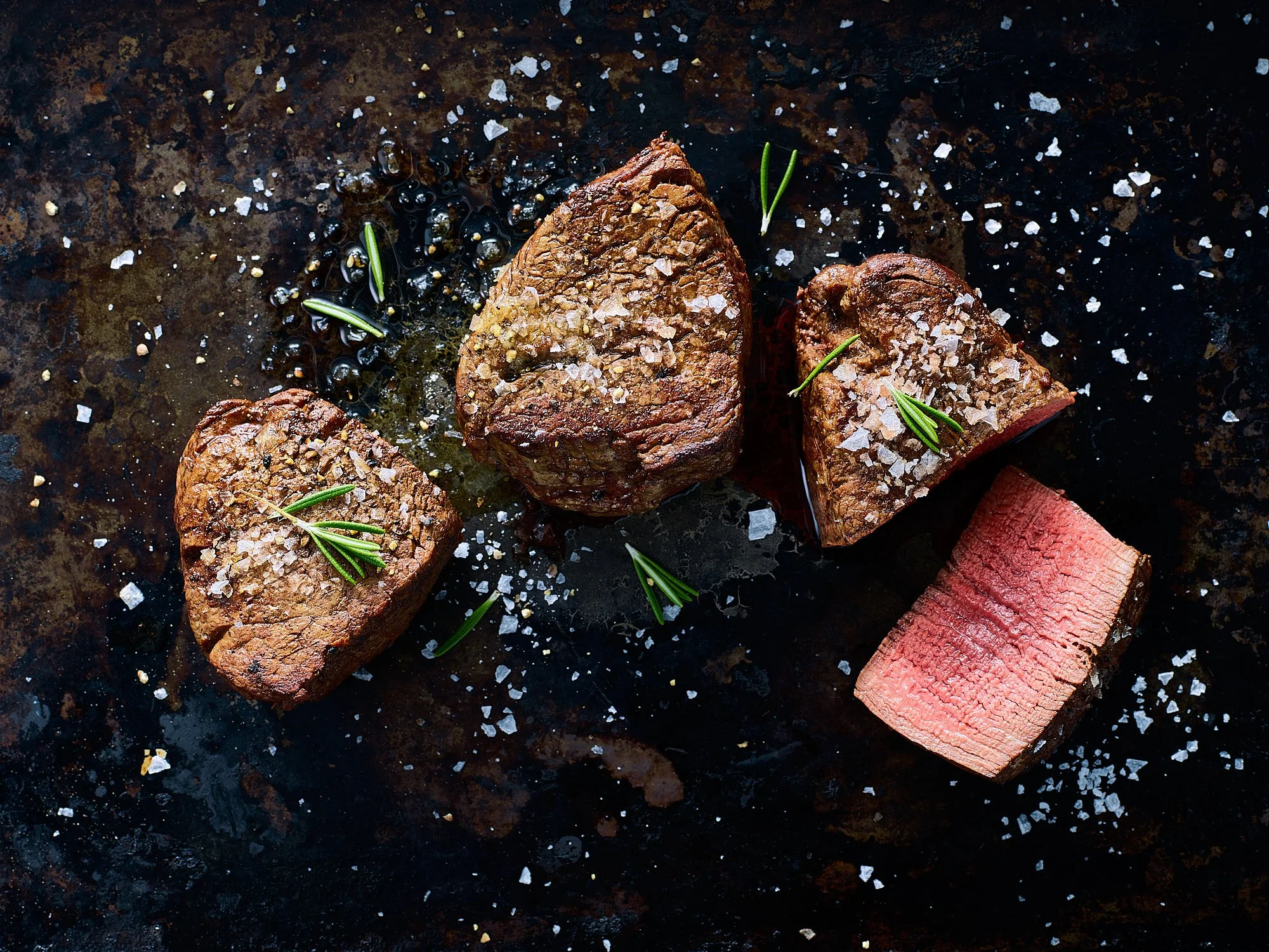 Filet Mignon dark surface food advertising photography by Dhanraj Emanuel, CPG meat photographer, Greensboro, NC