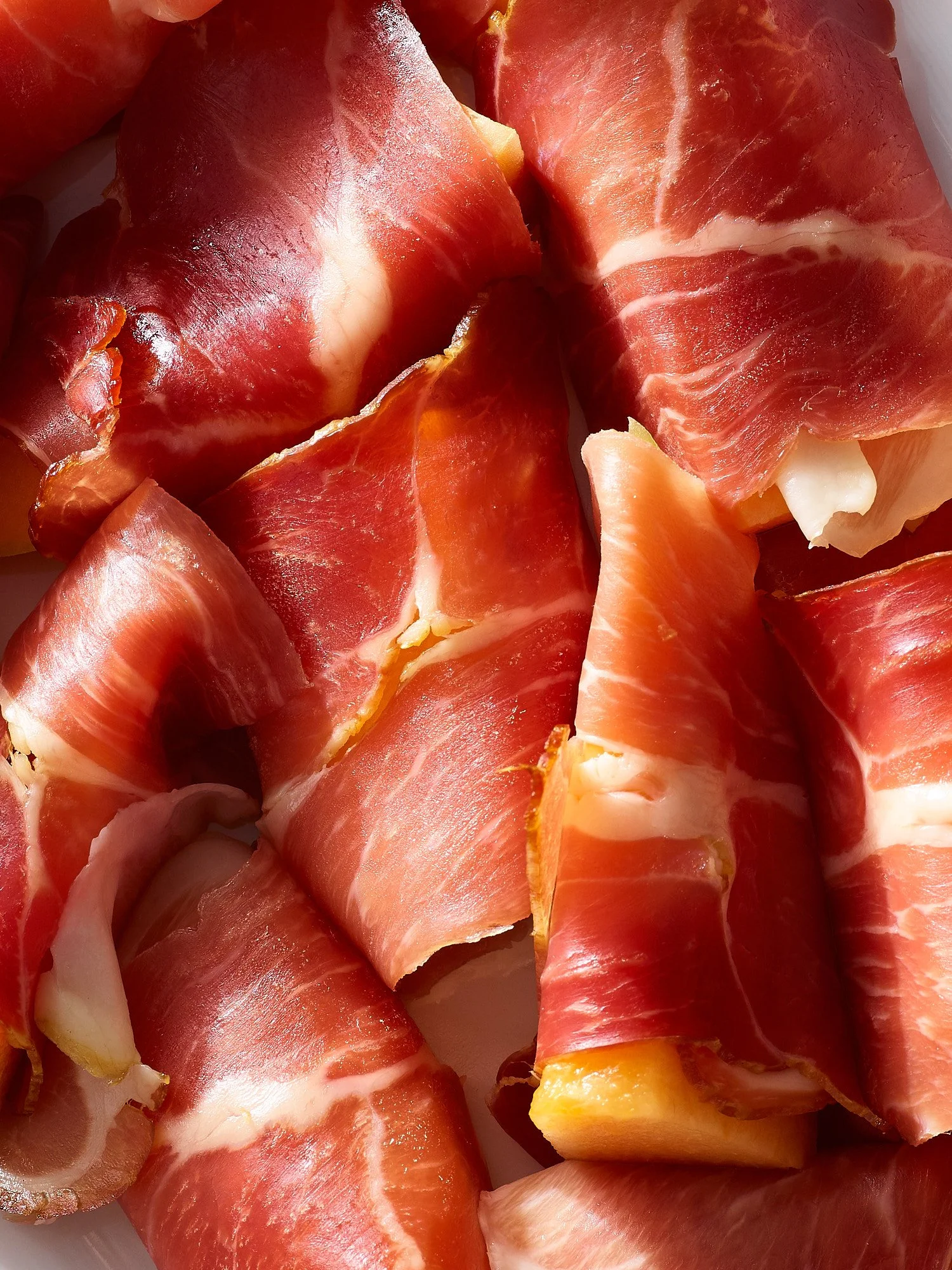 Prosciutto extreme close luminous editorial food advertising photography by Dhanraj Emanuel, CPG food photographer Greensboro NC