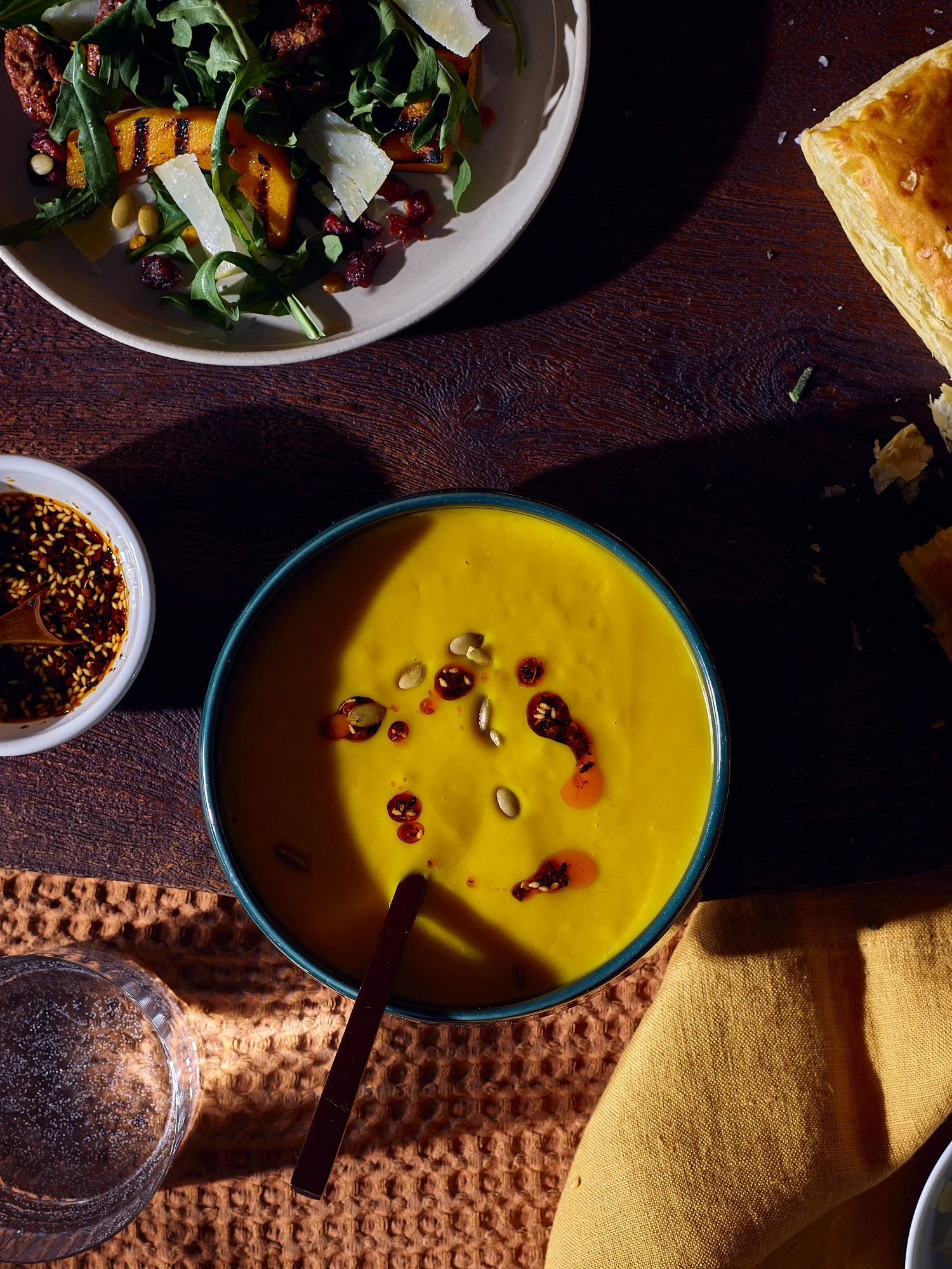Butternut squash dark raking light teal bowl food advertising photography by Dhanraj Emanuel, studio food photographer Greensboro NC