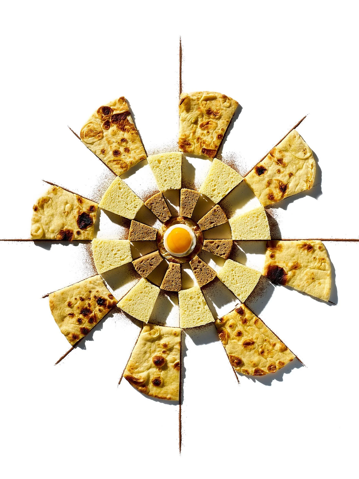 Fully Fed Up dartboard flatbread hummus conceptual food advertising photography by Abraham Jacobs by Dhanraj Emanuel, conceptual food photographer Greensboro NC