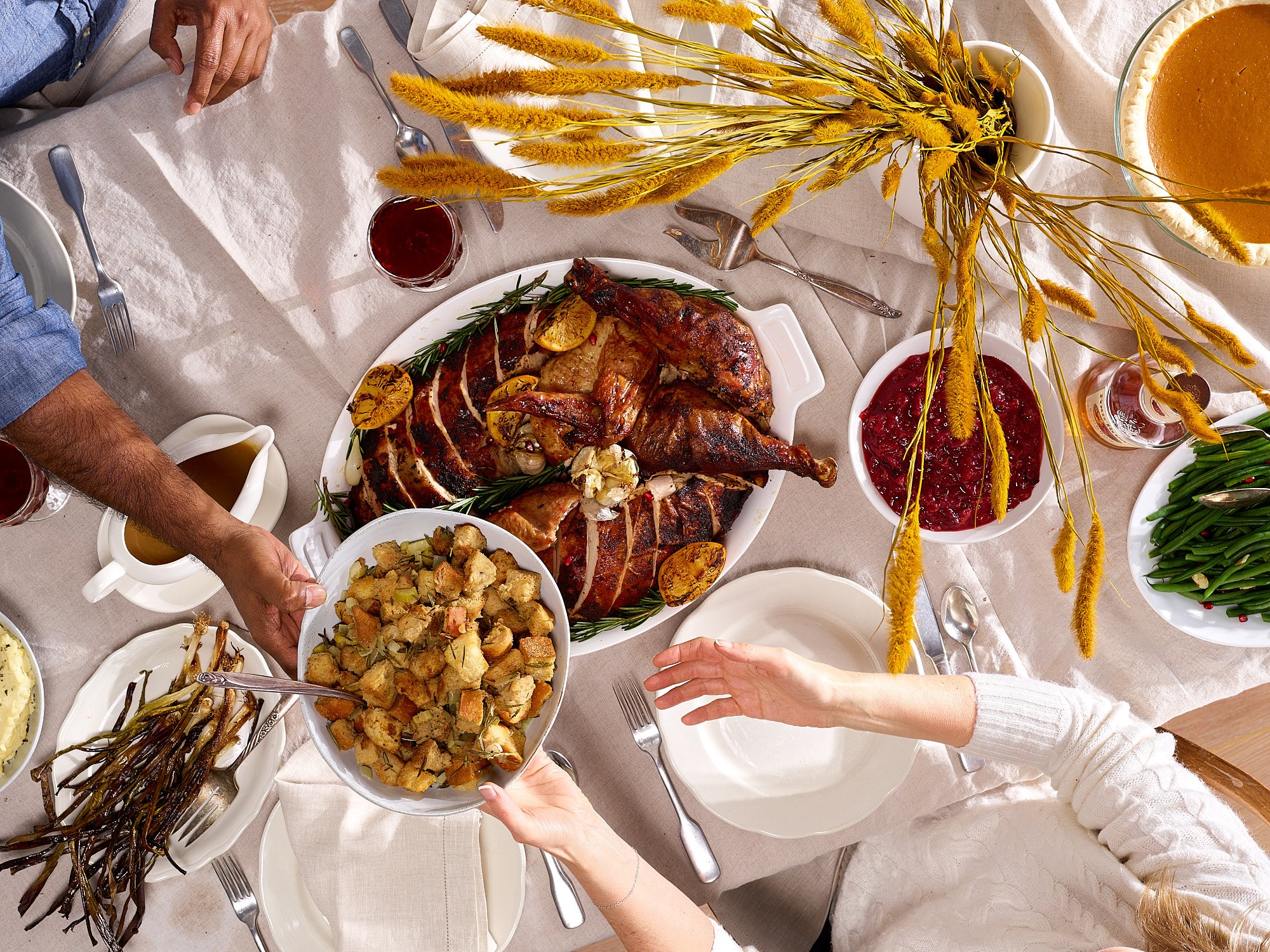 Food advertising photography by Dhanraj Emanuel — overhead Thanksgiving feast with roasted turkey, cranberry sauce, and seasonal sides, shot for The Fresh Market. Lifestyle food photographer for CPG and grocery brands, available nationwide.