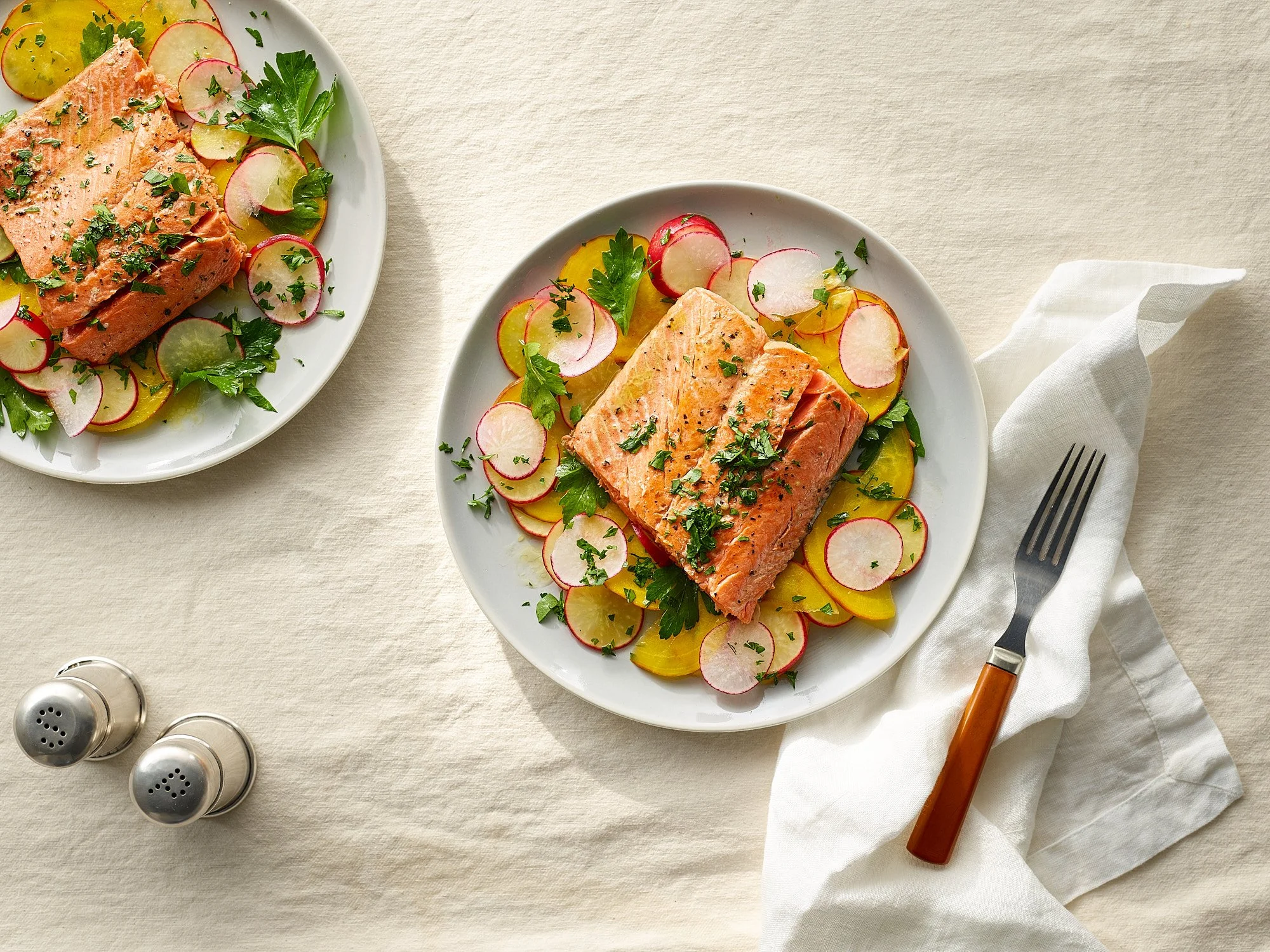 Commercial food photography by Dhanraj Emanuel — plated salmon fillet with radishes and herbs, shot for The Fresh Market. Food advertising photographer for CPG brands and editorial clients, working nationally.