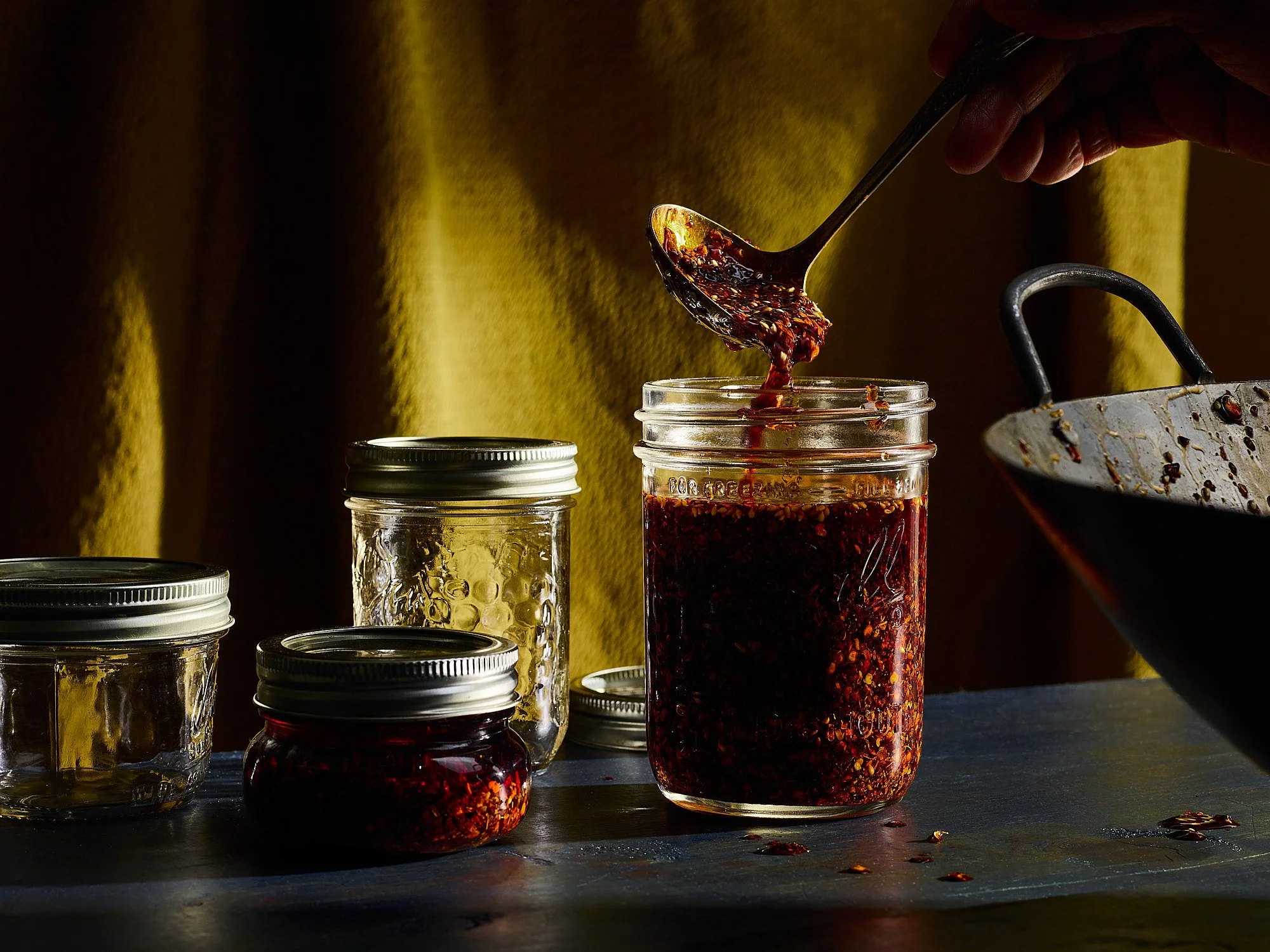 Chili oil dark dramatic food advertising photography by Dhanraj Emanuel, CPG food photographer Greensboro NC
