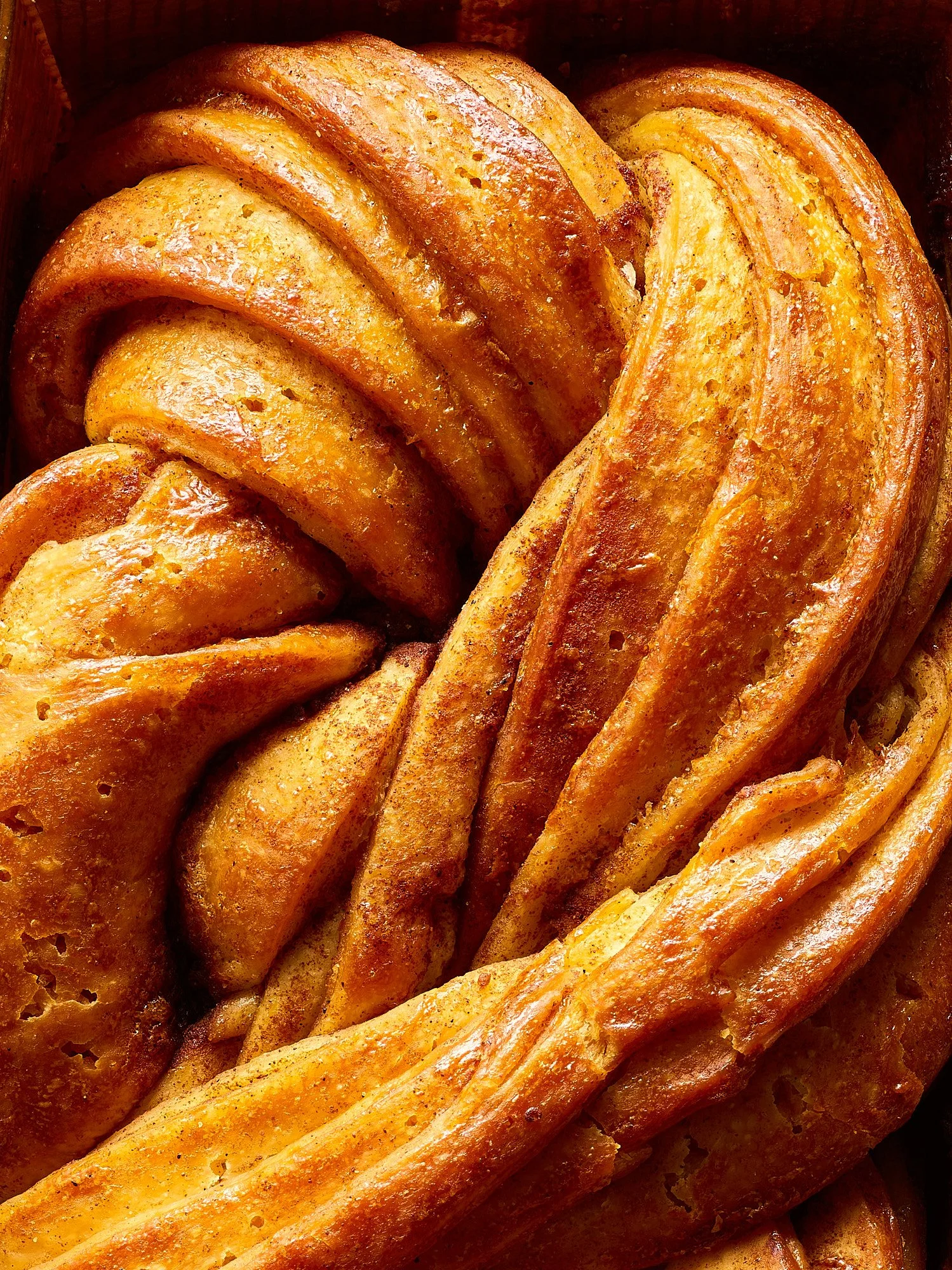 Food advertising photography by Dhanraj Emanuel — close-up of freshly baked braided babka with golden crust. Commercial food photographer for bakery brands, CPG, and editorial clients, available nationwide.