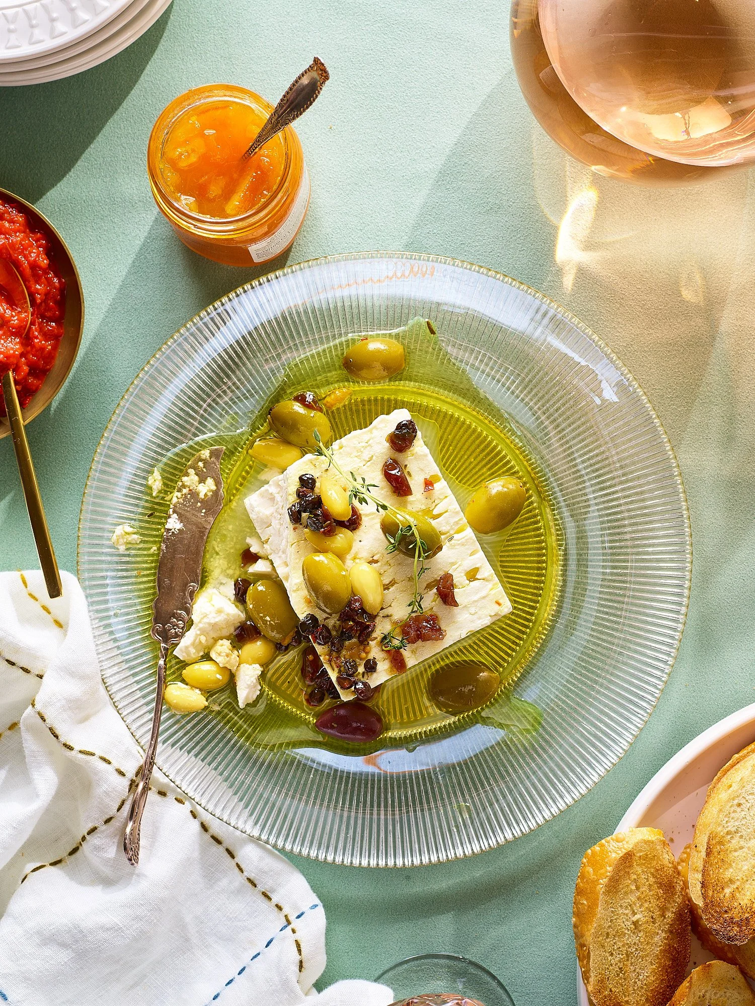 Feta cheese with olives olive oil mint peach world editorial food advertising photography by Dhanraj Emanuel, CPG food photographer Greensboro NC